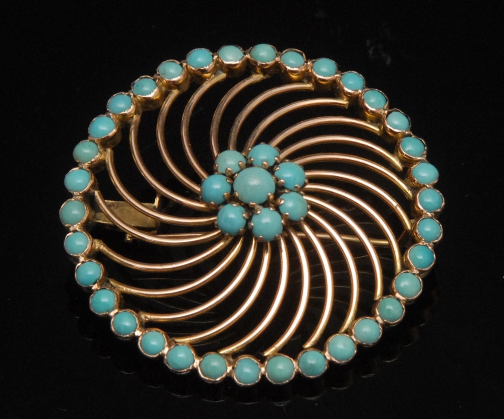 A continental high carat gold and turquoise wheel brooch, central seven turquoise bead flower