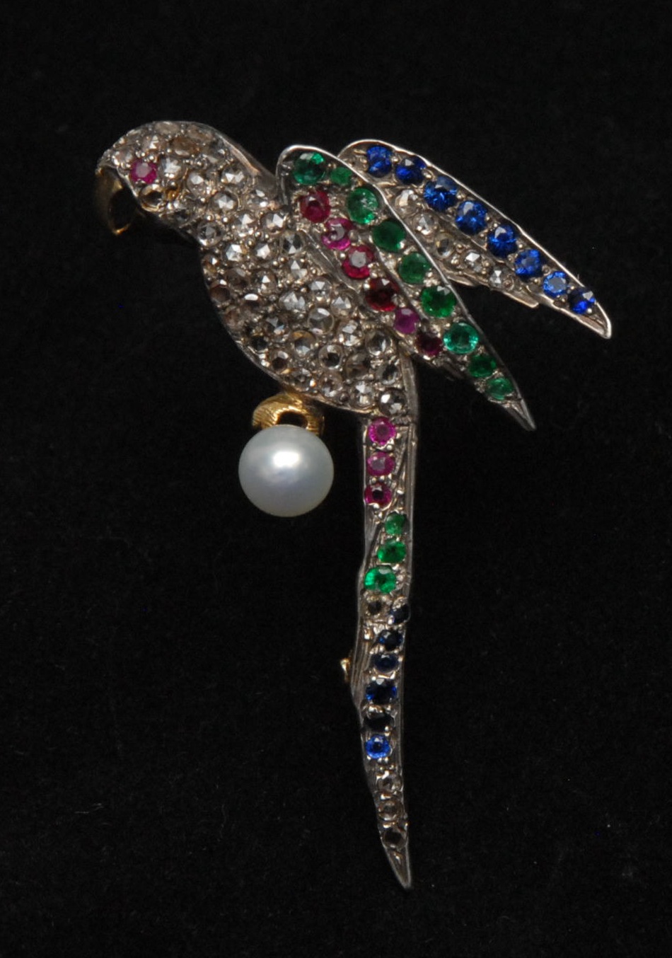 A diamond, emerald, ruby, sapphire and pearl parrot brooch, encrusted with fifty four diamonds,