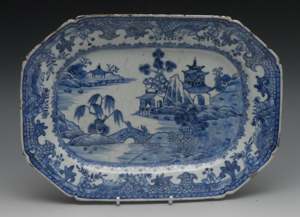 A Chinese canted rectangular blue and white serving plate, painted with pagoda, rock trees, bridge