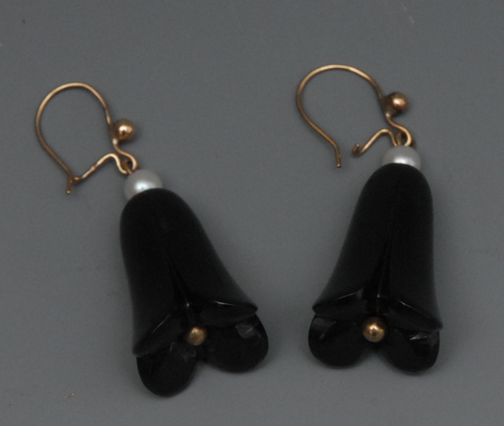 A pair of 20th century Whitby Jet and seed pearl tulip head floral drop earrings, gold wire hook