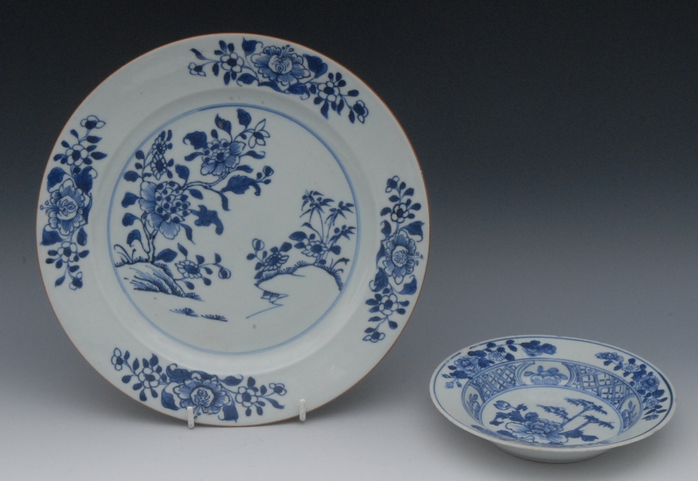 A Chinese blue and white porcelain circular plate, painted underglaze with peonies and rocky