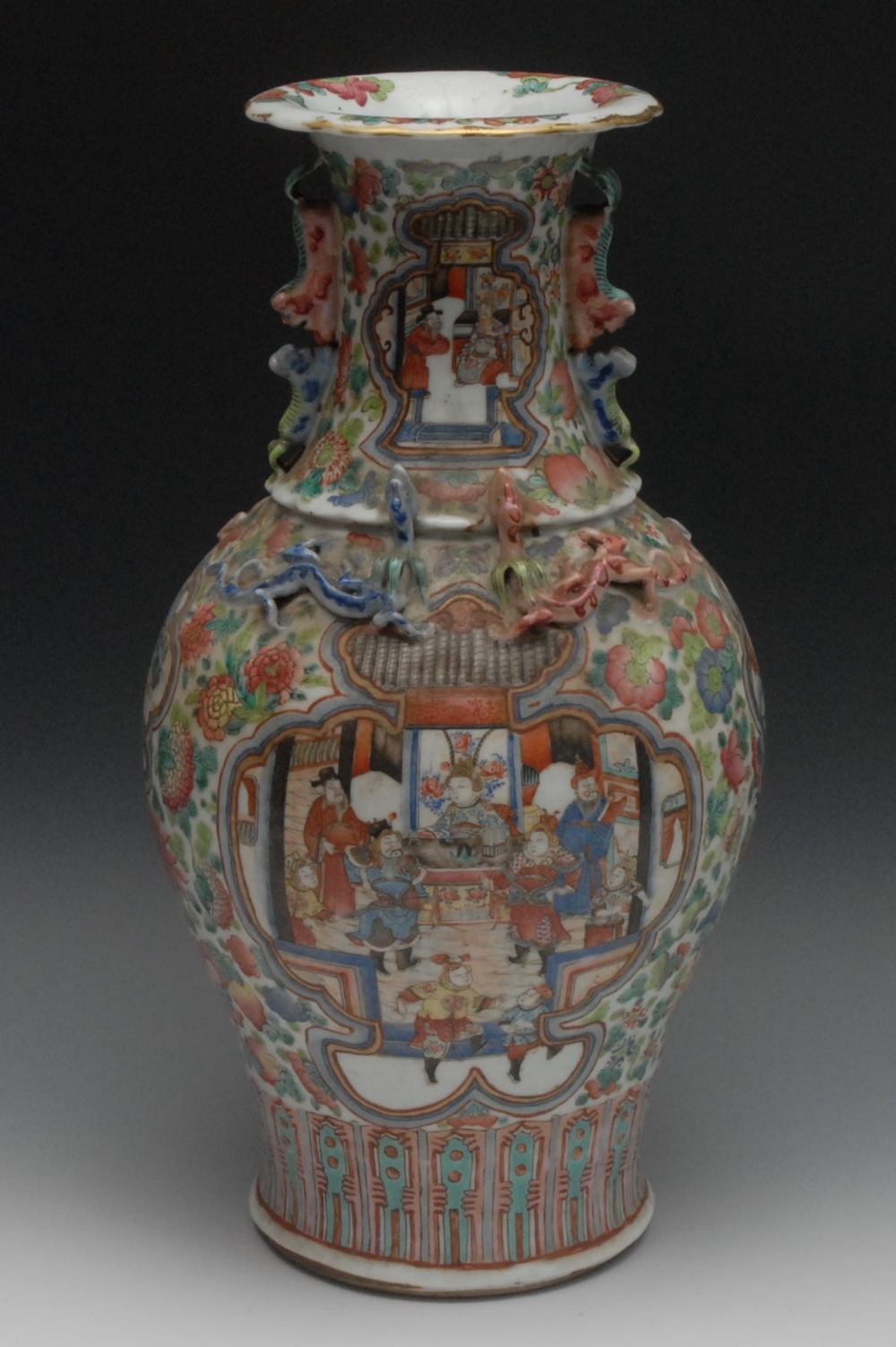 A Cantonese porcelain baluster vase, painted in the Famille Rose palette with soldiers in battle, to