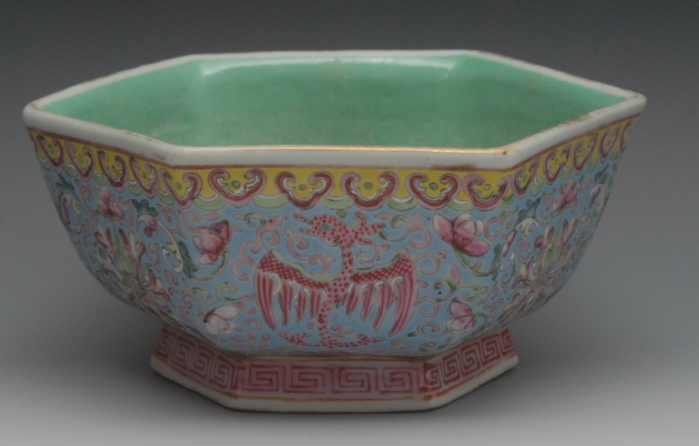 A Chinese Famille Rose hexagonal bowl, decorated with phoenix and lotus in tones of red on an