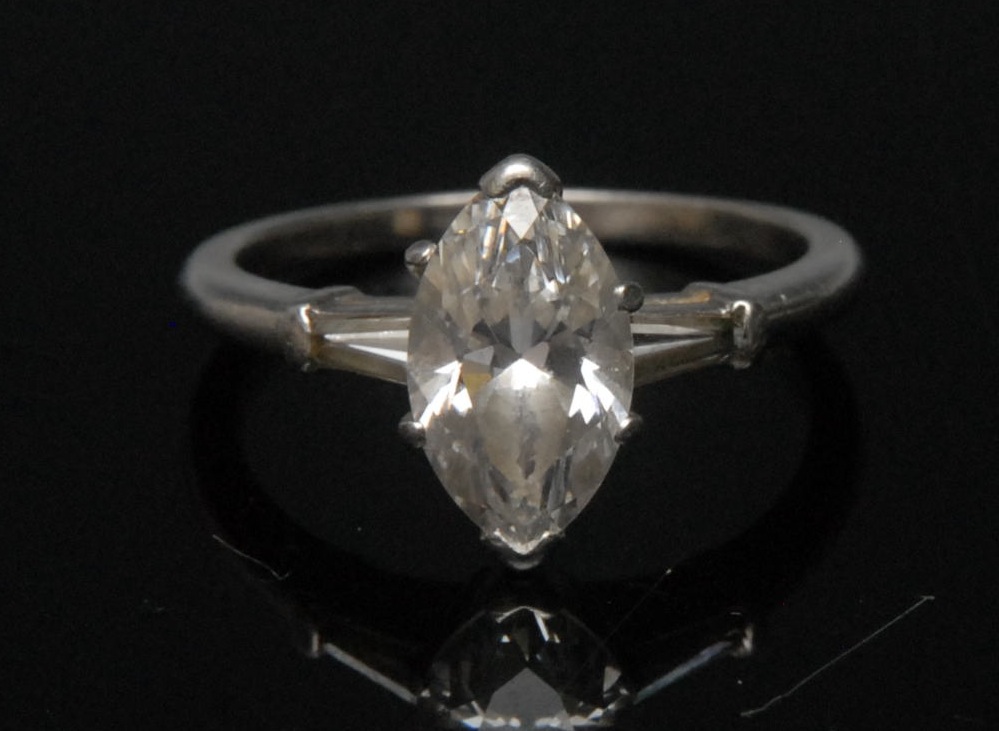 A diamond solitaire ring, the marquise diamond  approx. 1.6ct, platinum shank, finger size L, 4.4g