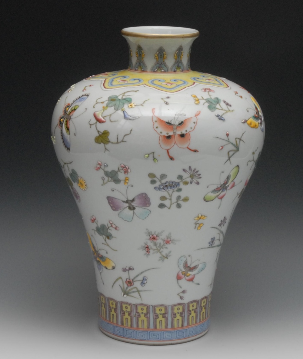 A Chinese porcelain shouldered ovoid vase, brightly painted in raised polychrome enamels with