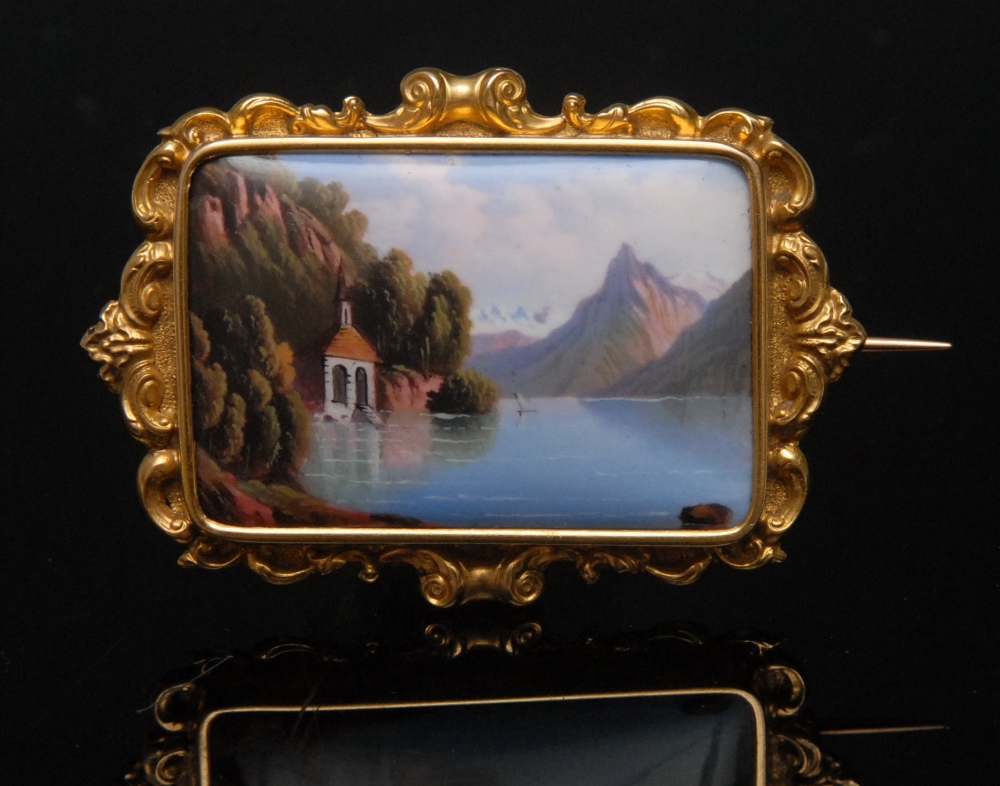 A 19th century Italian enamelled tablet brooch, the convex rectangular panel painted with