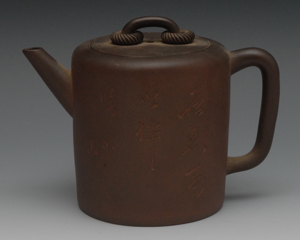 A Chinese Yixing cylindrical teapot, inscribed with characters, loop handle, 12cm high, impressed