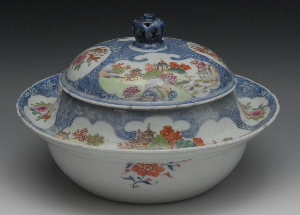 A Chinese porcelain circular tureen, painted with pagoda landscapes, flowers and insects within