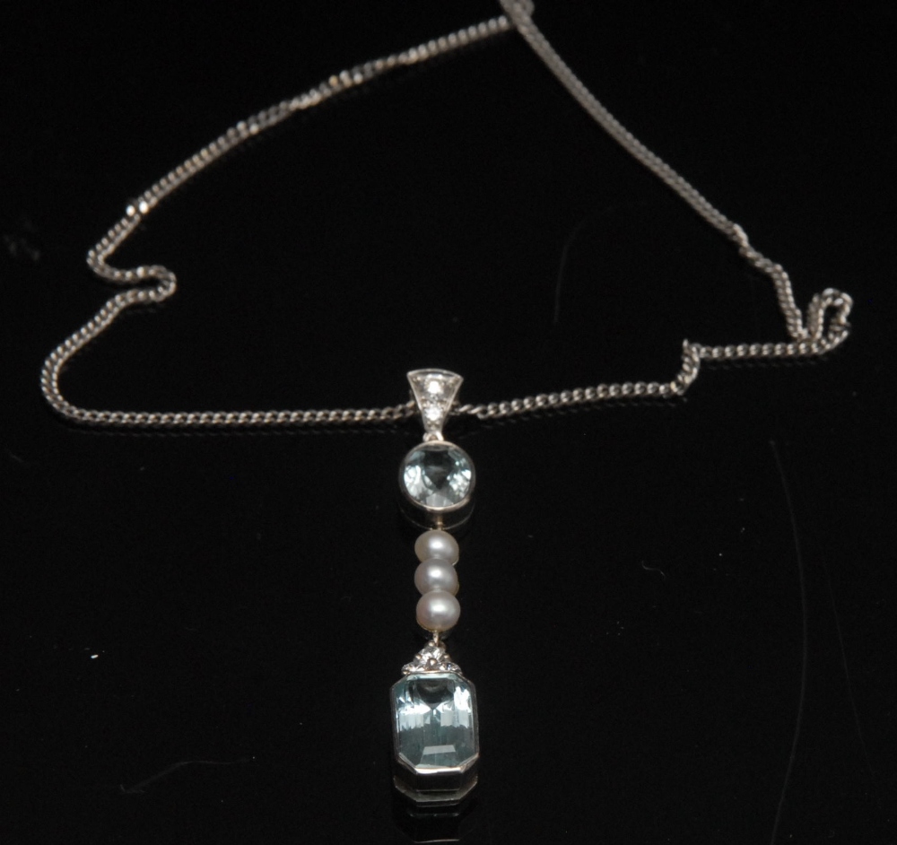 A diamond aquamarine and seed pearl pendant necklace, inverted triangular diamond slide link,