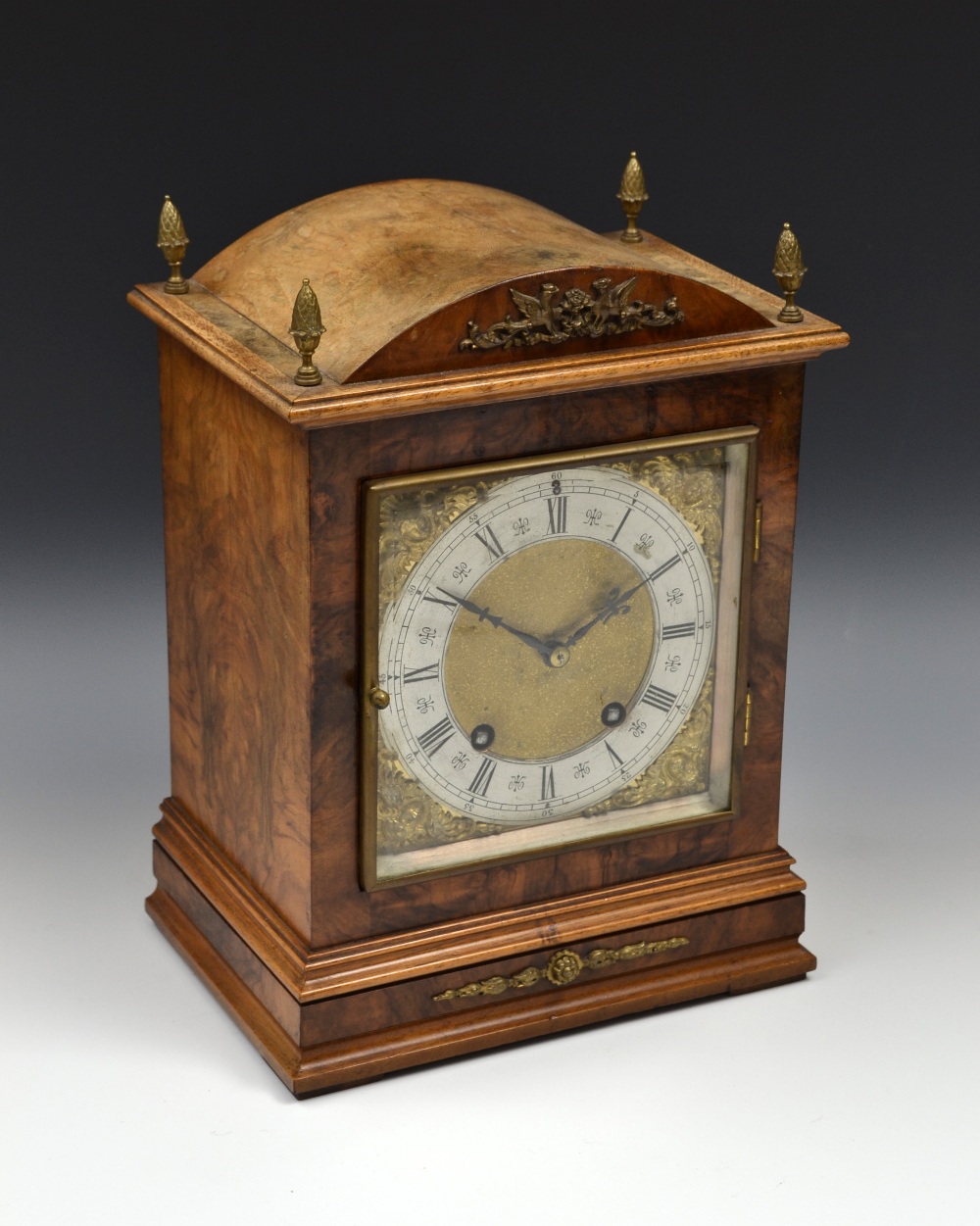 A late 19th century gilt metal mounted walnut bracket clock, 16cm rectangular brass dial with