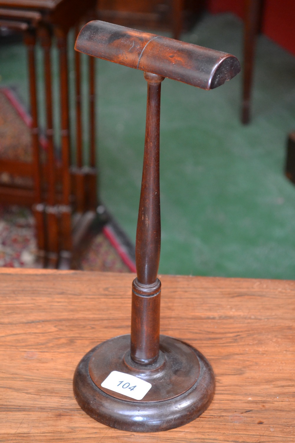 A 19th century mahogany wig or bonnet stand, turned slender column, turned base, 32cm high