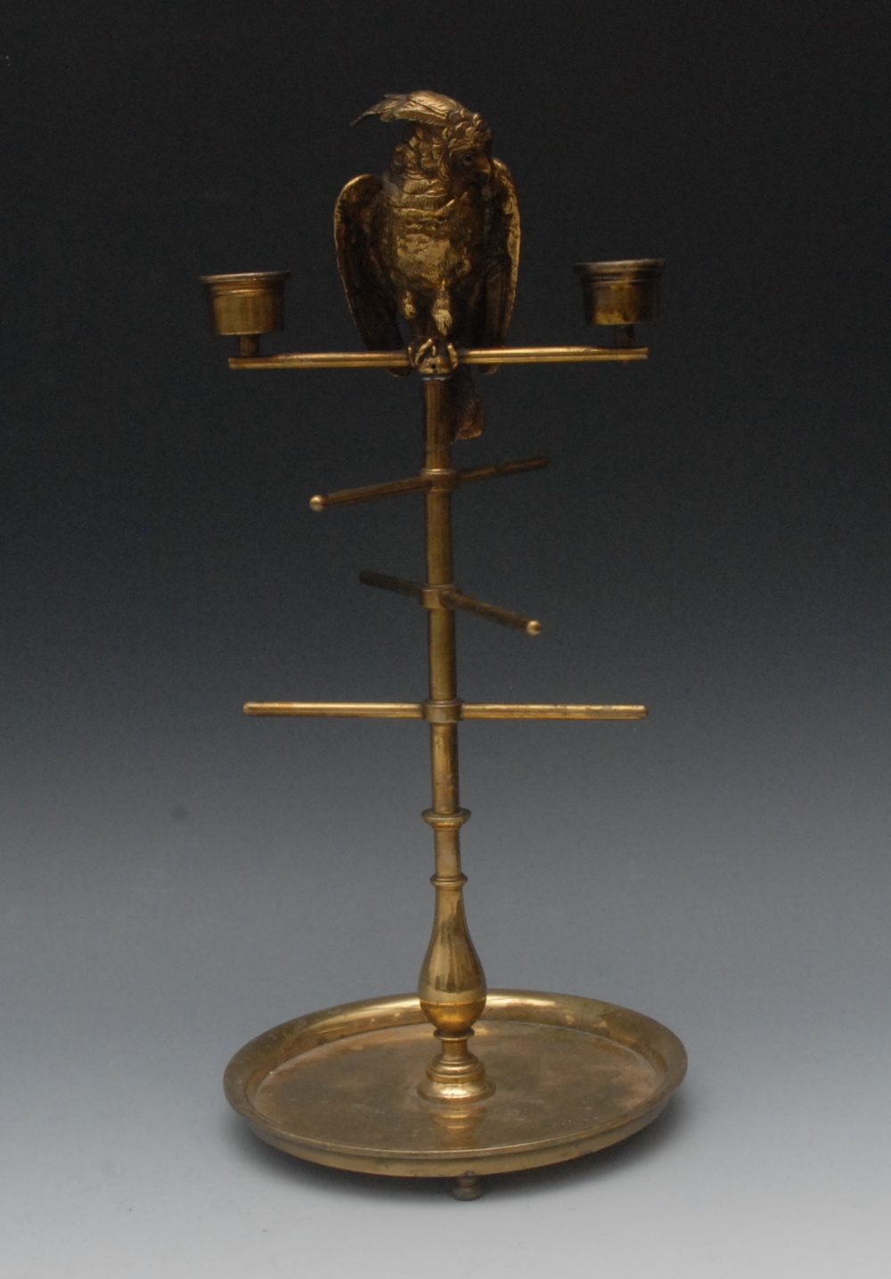 A 19th century novelty dressing table jewel stand and candelabra, cast with a parakeet on a perch,