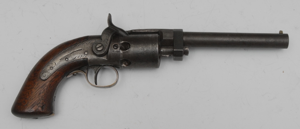 A percussion revolver side hammer, 9mm bore 11cm long barrel, six shot cylinder, top frame