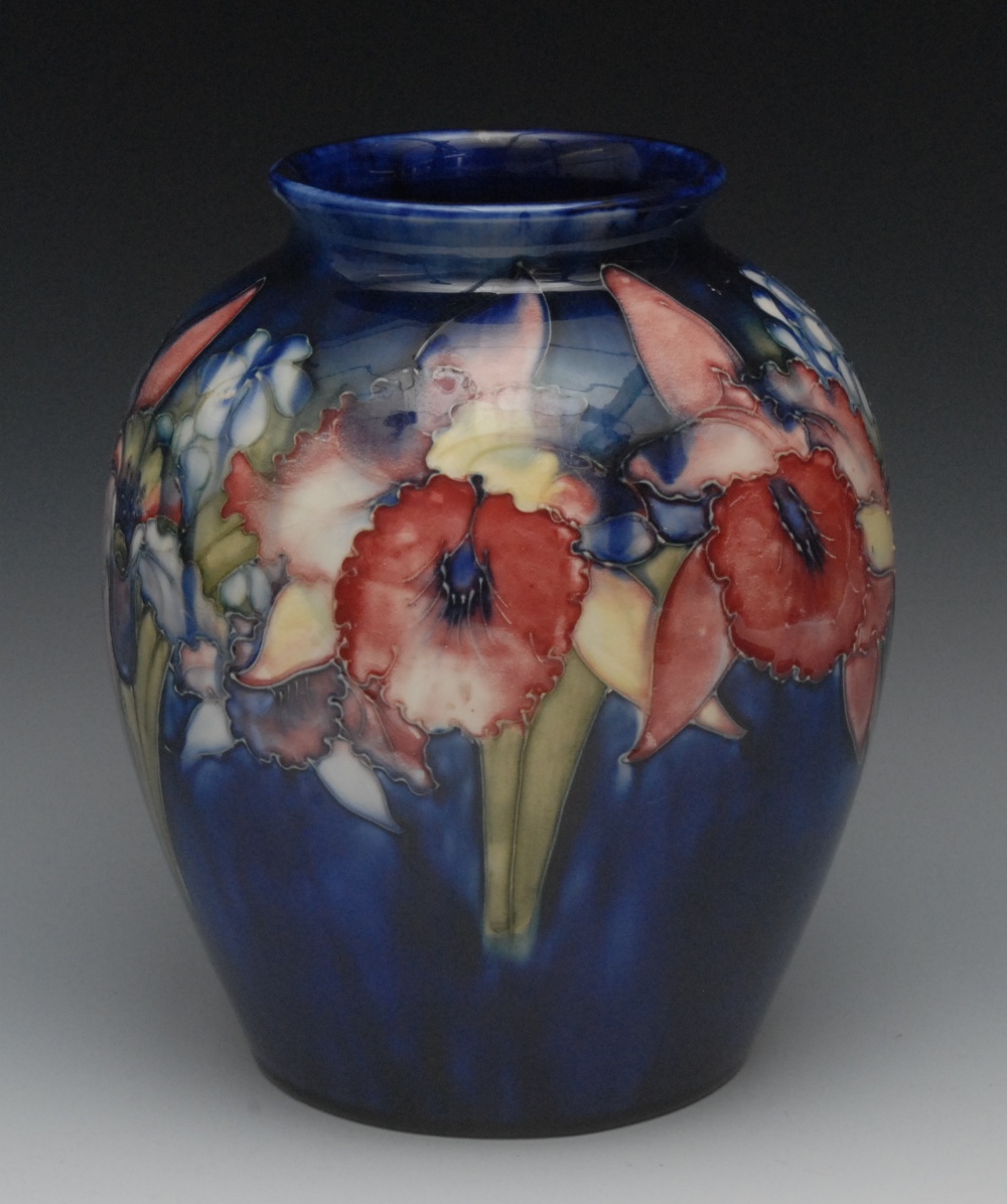 A Moorcroft  Orchid and Spring Flowers pattern ovoid vase, tube lined with large flower in tones