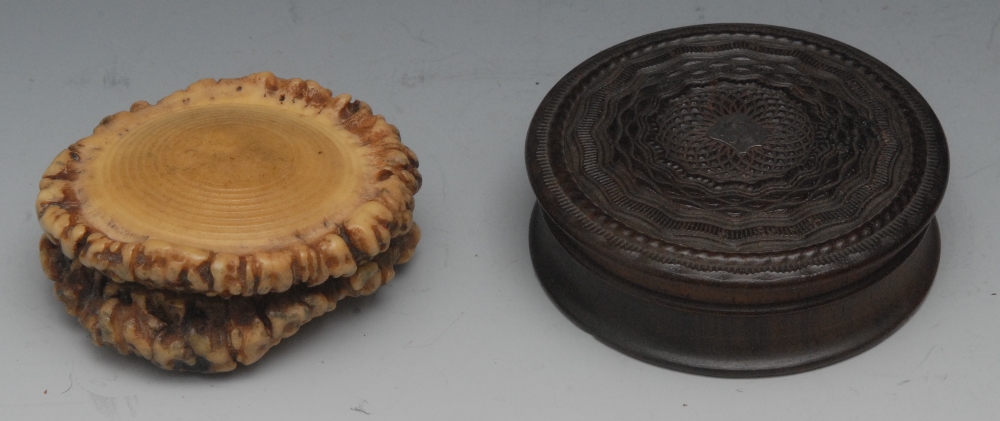 A Victorian Scottish antler horn circular waisted snuff box, the push on cover carved with a stag'
