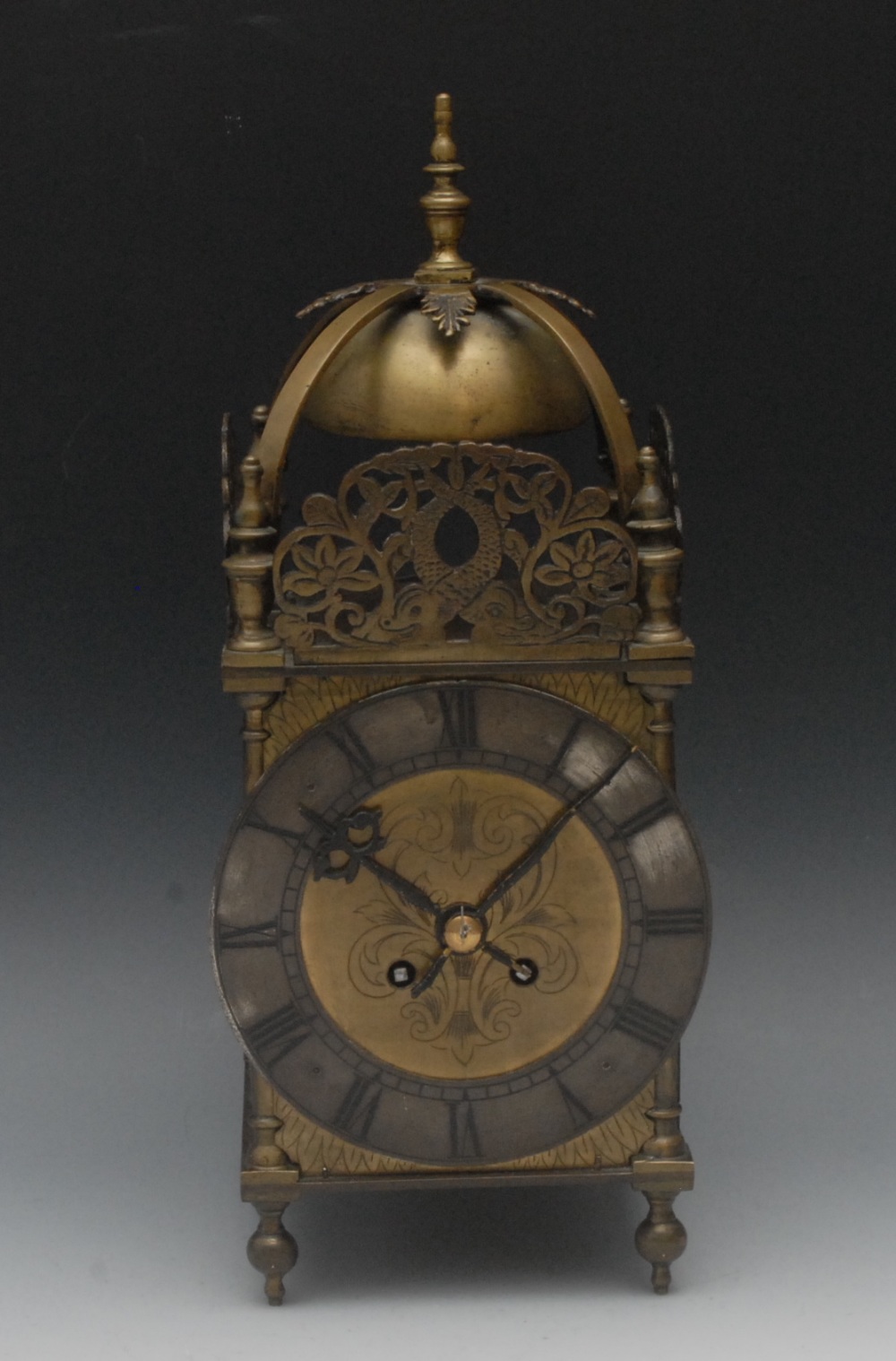 A 17th century style brass lantern clock, 15cm chapter ring inscribed with Roman numerals, twin