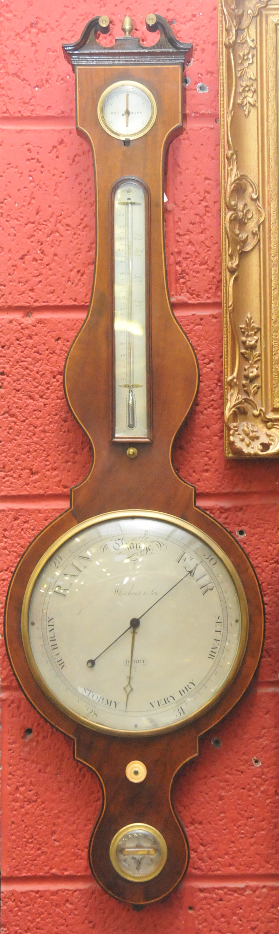 An early 19th mahogany , satinwood and boxwood strung banjo barometer, the 25cm diam silvered dial