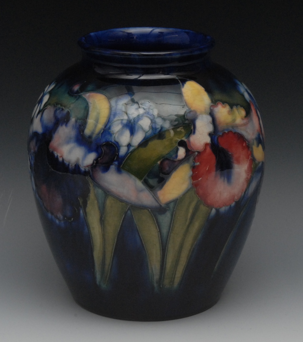 A Moorcroft  Orchid and Spring Flowers pattern ovoid vase, tube lined with large flower in tones