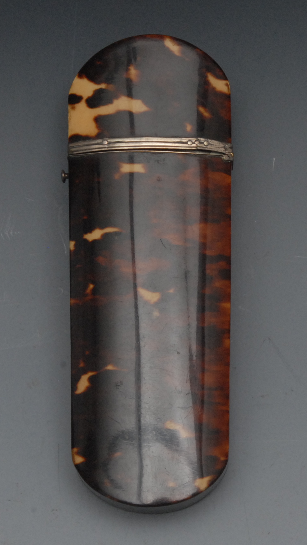 A late George III tortoiseshell spectacles case, the hinged cover applied with an initialled white