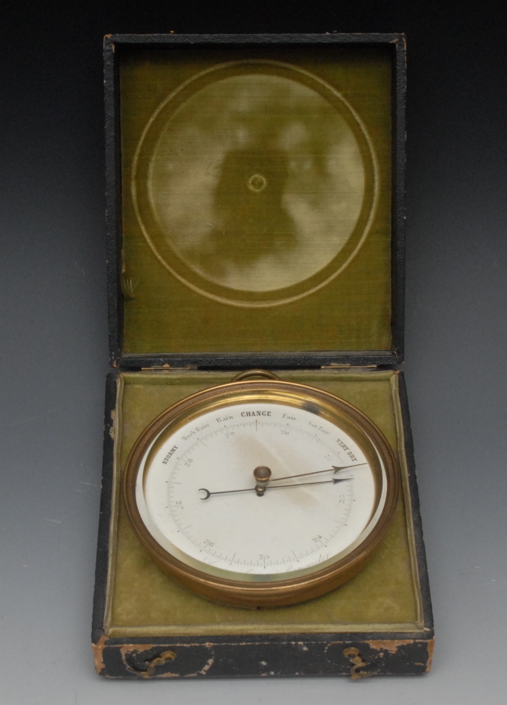 A Victorian lacquered brass aneroid barometer, 10.5cm silvered register, inscribed to verso Sold