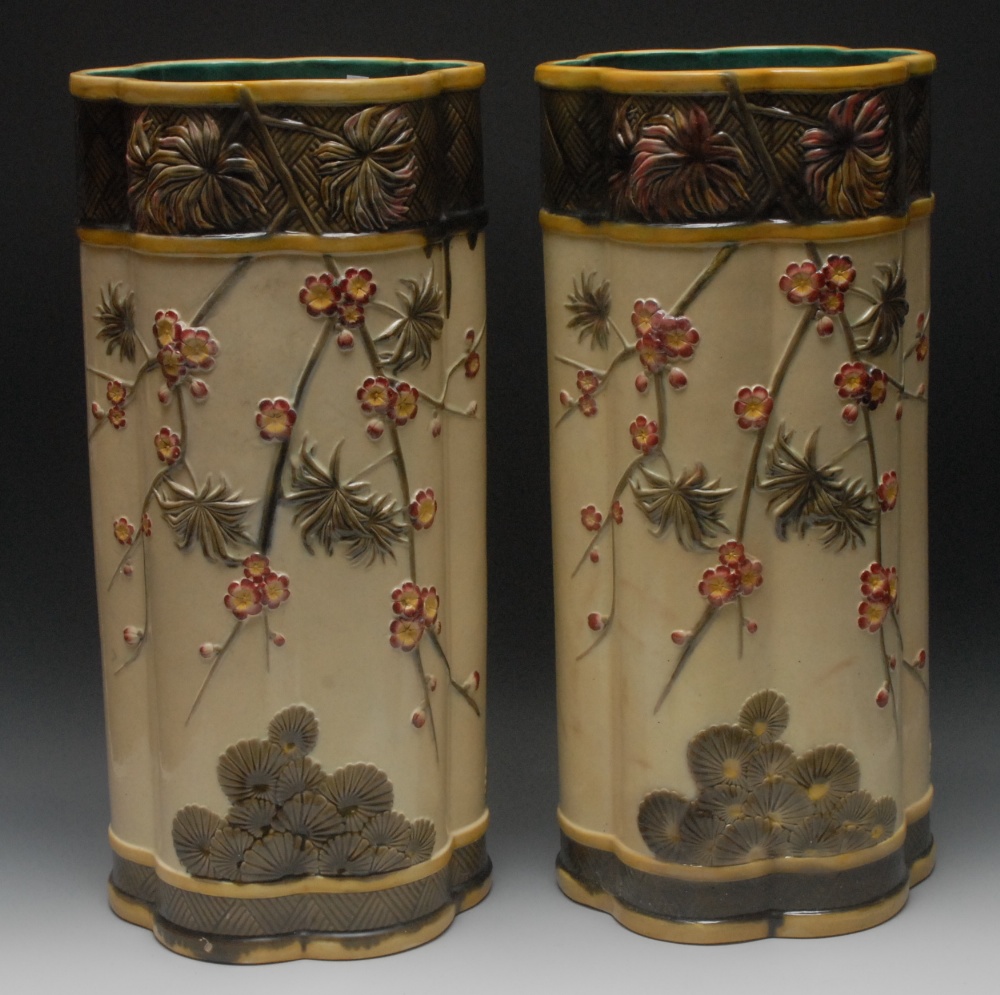 A pair of Wedgwood majolica Aesthetic Movement lobed cylindrical stick stand, applied in relief with