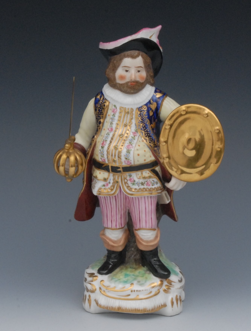 A Sampson Hancock Derby figure, Falstaff, he stands as a corpulent, bearded knight with long hair,