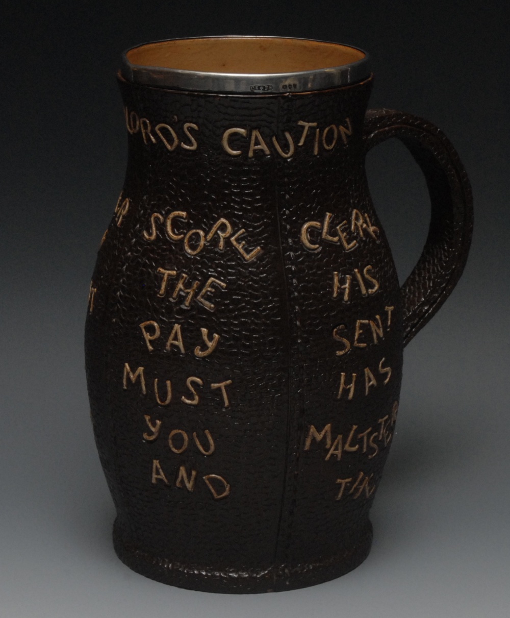A Doulton Lambeth faux leather jack beer jug,  silver mounted, inscribed with The Landlord's