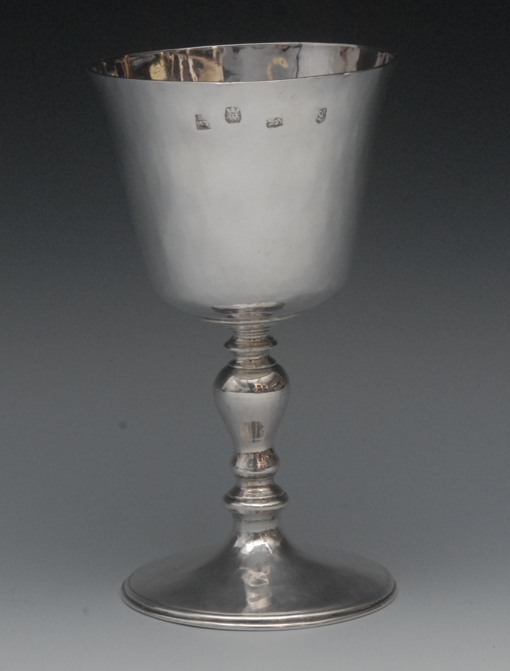 A Charles I silver pedestal chalice, slightly flared bucket shaped bowl initialled S over TI,