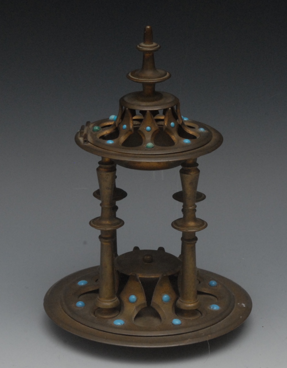 A Gothic Revival brass incense burner, disc and spire finial, hinged cover pierced with tracery,