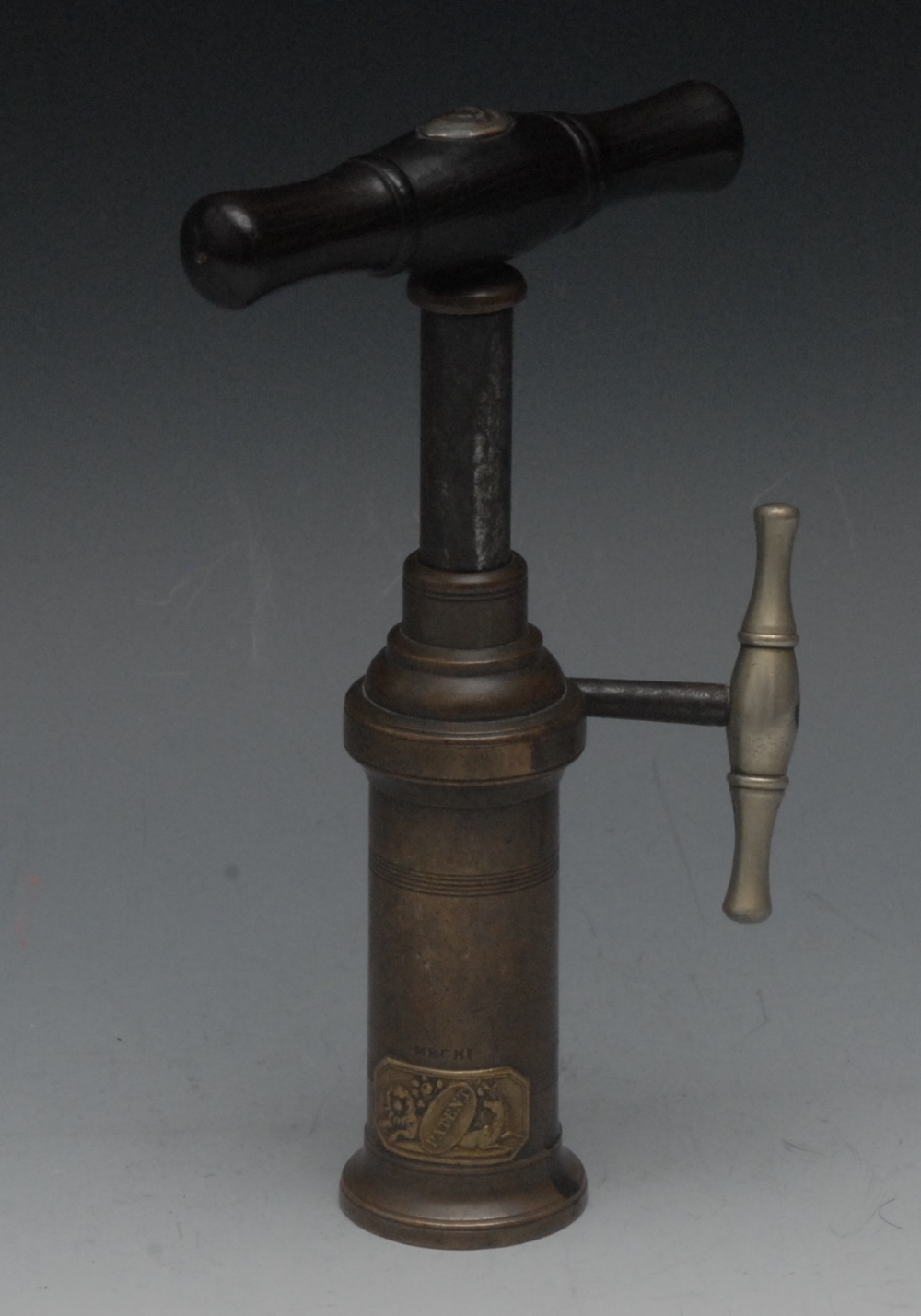 An English Thomason type double action corkscrew, bronze barrel, embossed gilt brass royal arms