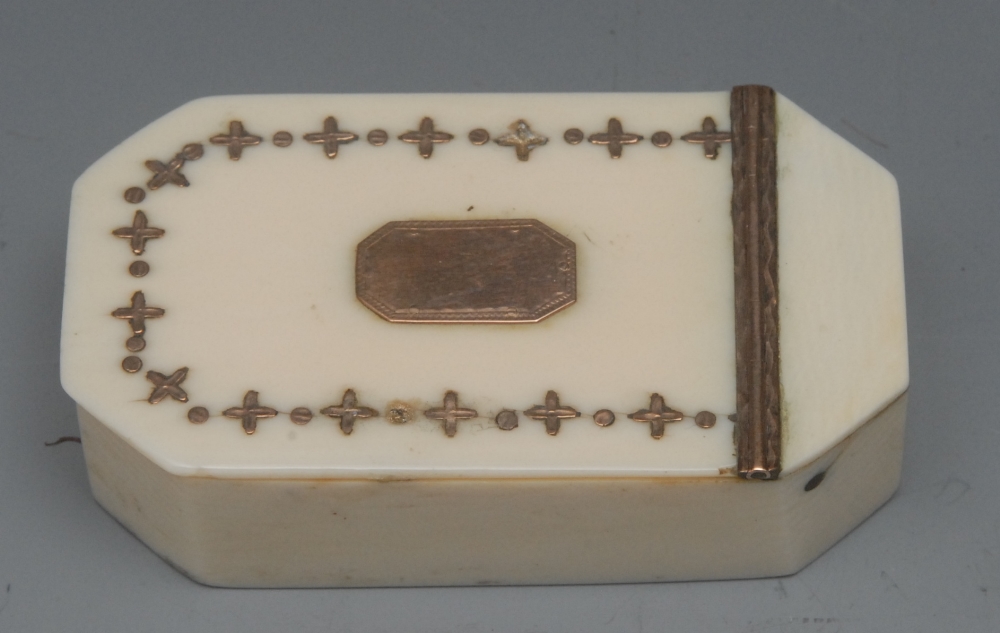 A George III ivory and piqué work canted rectangular snuff box, the hinged cover applied with a band