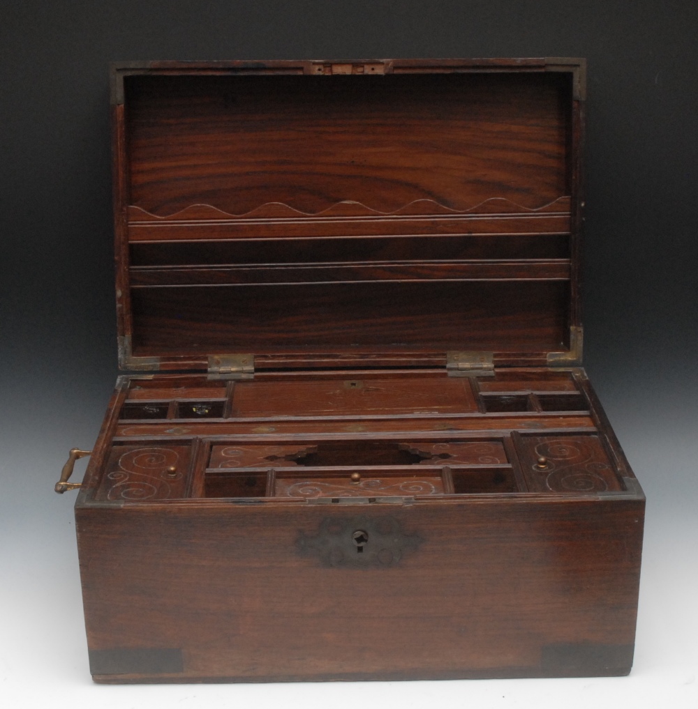 A large Anglo-Indian brass mounted hardwood dressing box, hinged cover inlaid with a lozenge,