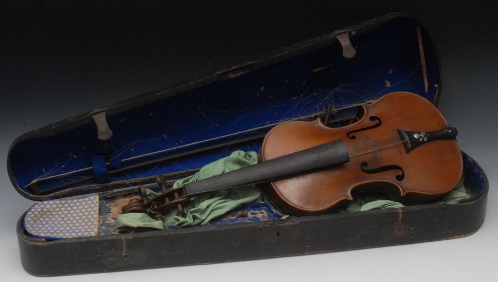 A violin, the two-piece back 36cm long excluding button, paper label inscribed Carlo Fissorie,