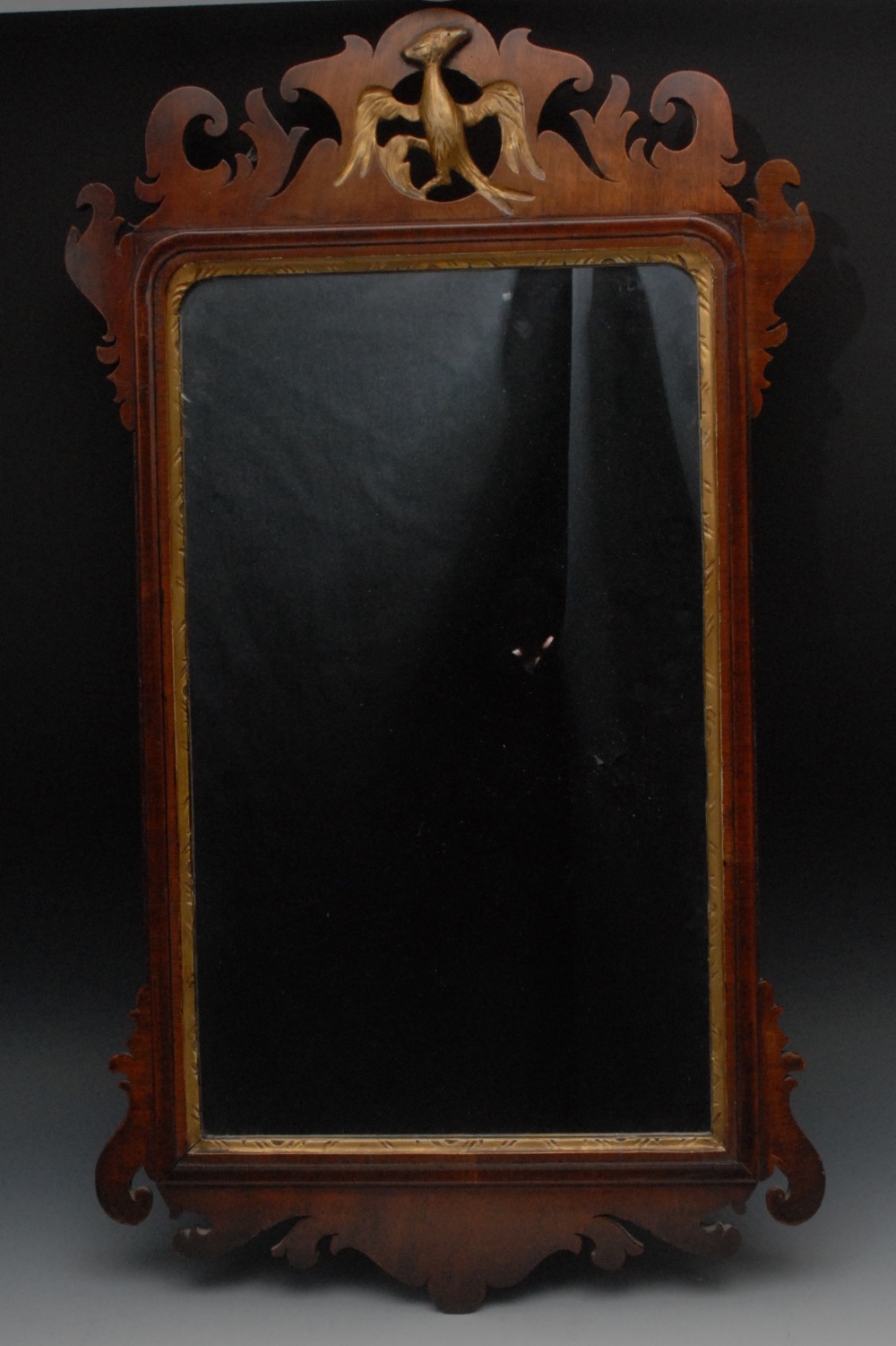 A George II style Vauxhall type looking glass, pierced with parcel gilt ho-ho bird cresting, 73cm