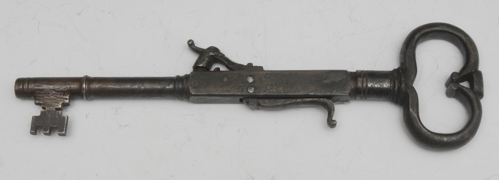 A percussion pistol, 8mm bore 9cm long barrel, made from a large antique key 25.5cm long, large ring