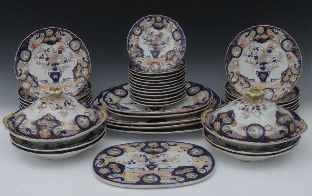 A Mason`s Patent Ironstone China part dinner service,  decorated in Imari colours with vases of