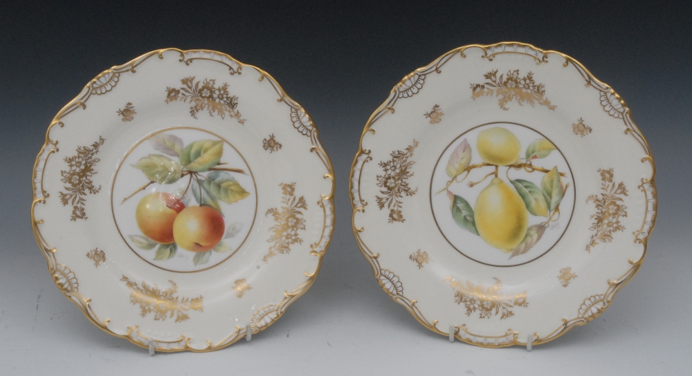 A pair of Mintons shaped circular plates, painted by Kalisz, signed with apples and lemons within