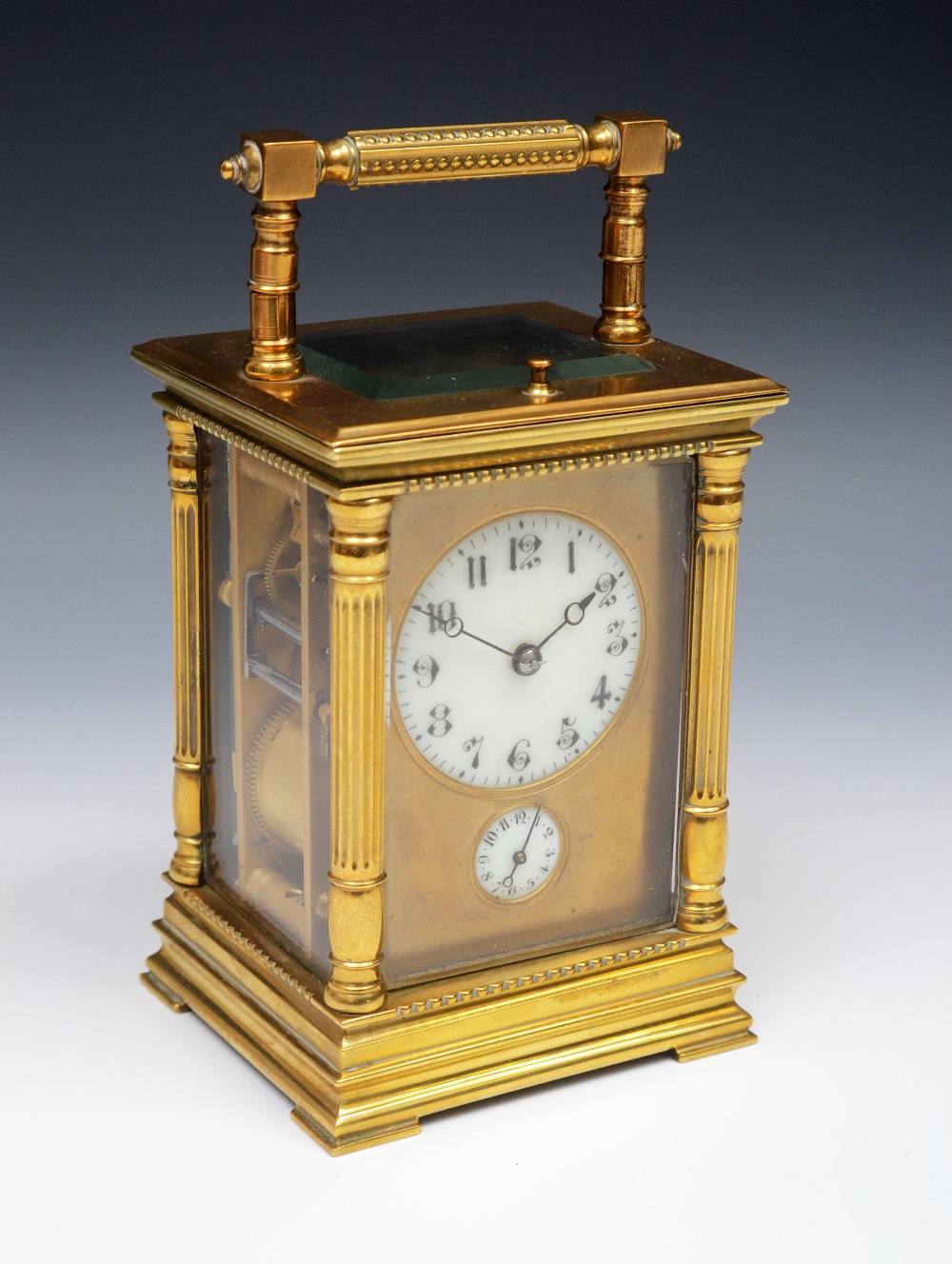 A late 19th century French gilt brass five glass repeating alarm carriage clock, 5cm slightly convex