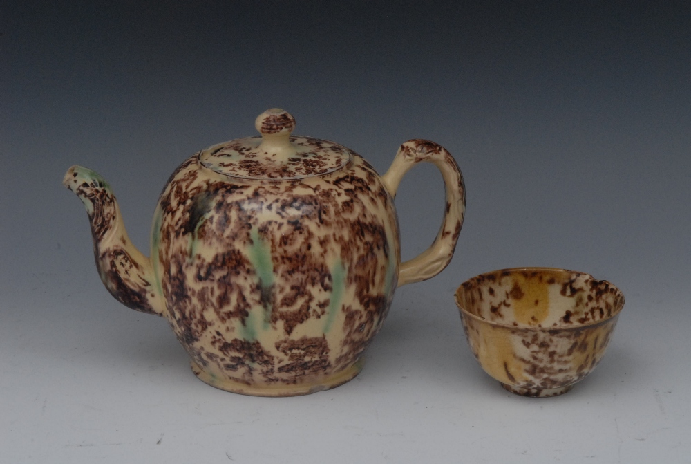 An 18th century Whieldon bullet shaped teapot and cover, mottled tortoiseshell glaze in  green and