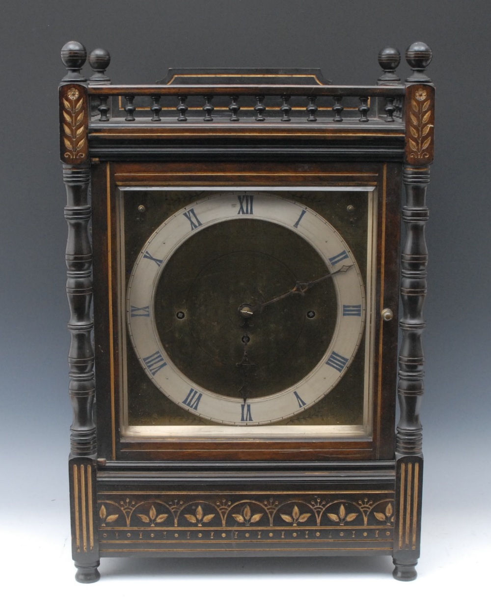 A large Aesthetic Movement gilt and ebonised bracket clock, 25cm rectangular brass dial with