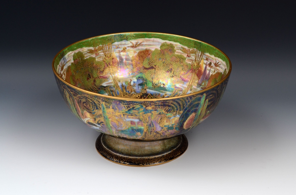 A Wedgwood Fairyland Lustre pedestal punch bowl, designed by Daisy Makeig Jones, the exterior in