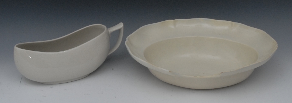 An English creamware oval barbers bowl, 35cm wide;  a Boots bourdalou, 27cm wide (2)