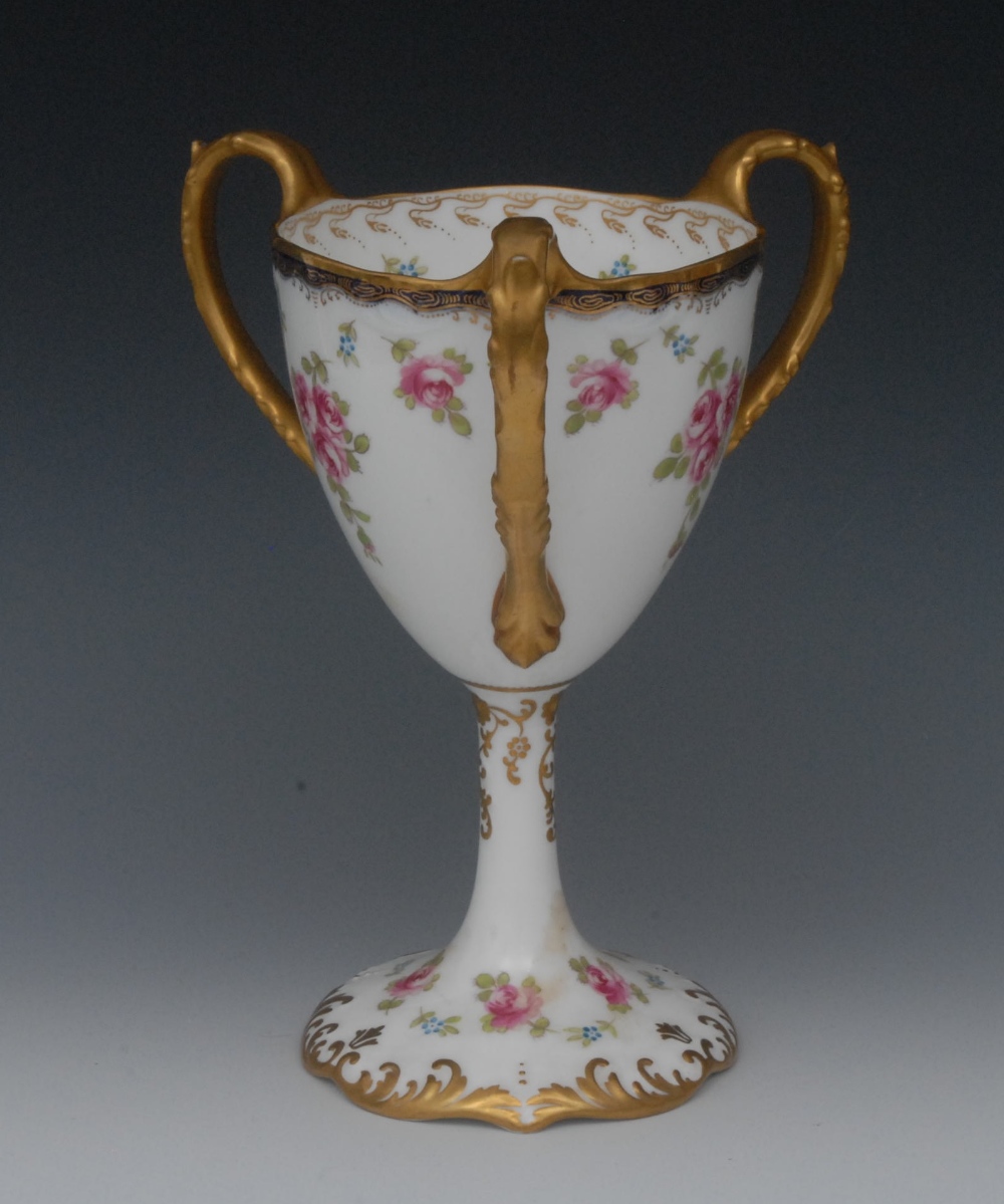 A Wedgwood three-handled vase, printed and painted with roses and forget-me-nots, cobalt blue
