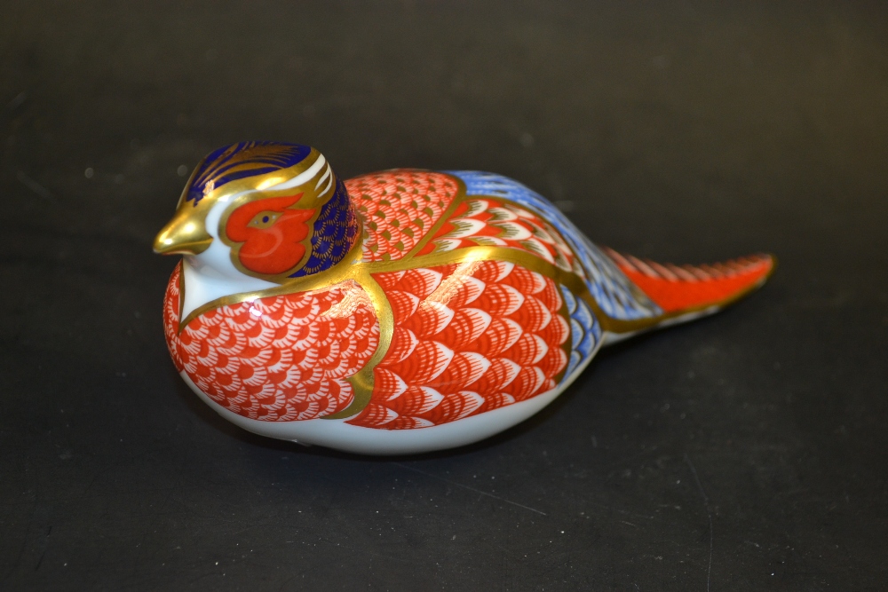 A Royal Crown Derby Partridge paperweight, gold stopper to base