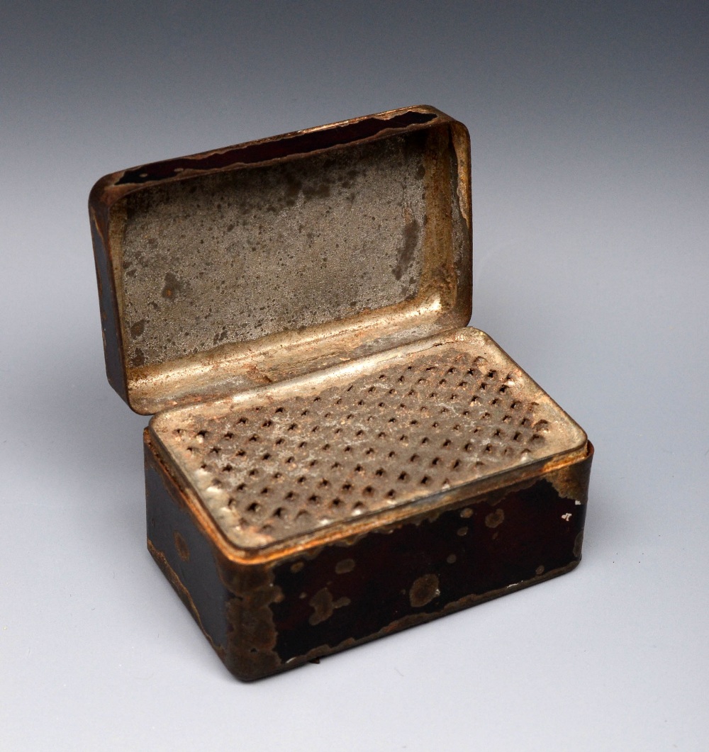 A George III toleware rounded rectangular nutmeg grater, hinged cover enclosing a rasp, further