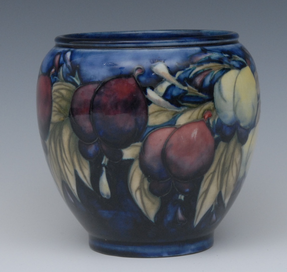 A Moorcroft Wisteria pattern ovoid vase, tube lined with flowers and foliage, in tones of red,