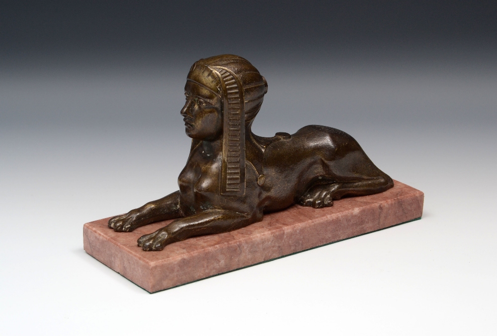 French School (19th century), a patinated bronze, of a sphinx, marble base, 22.5cm wide