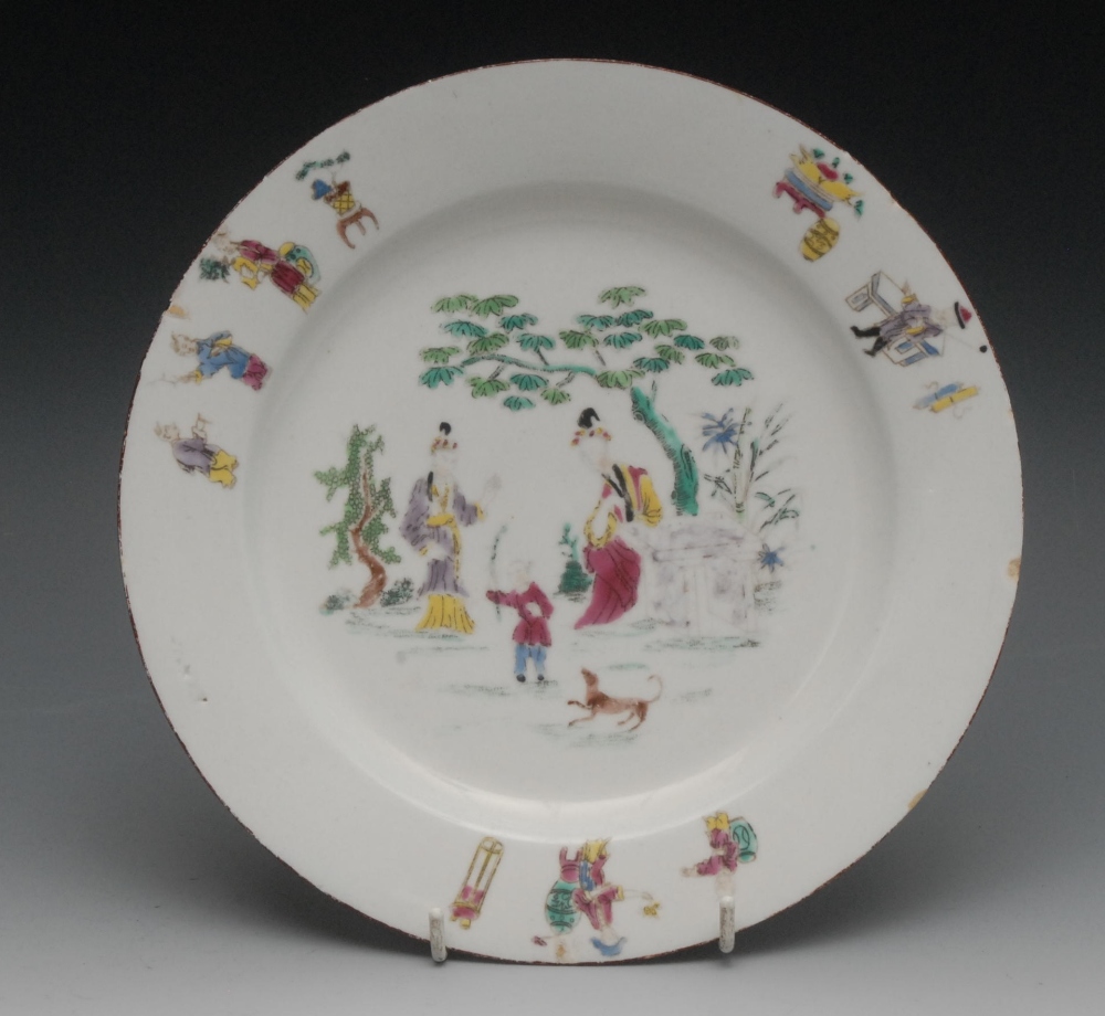 A Bow circular plate, enamelled in colours with two Oriental ladies watching a child playing with