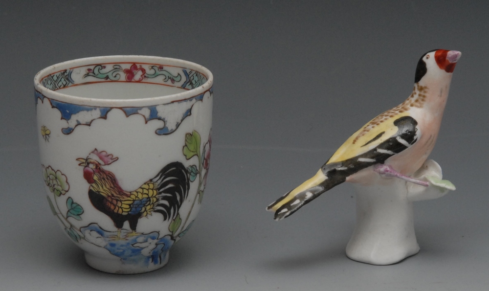 An English Porcelain coffee cup, enamelled in polychrome with cockerel and peony, c.1770; a model,