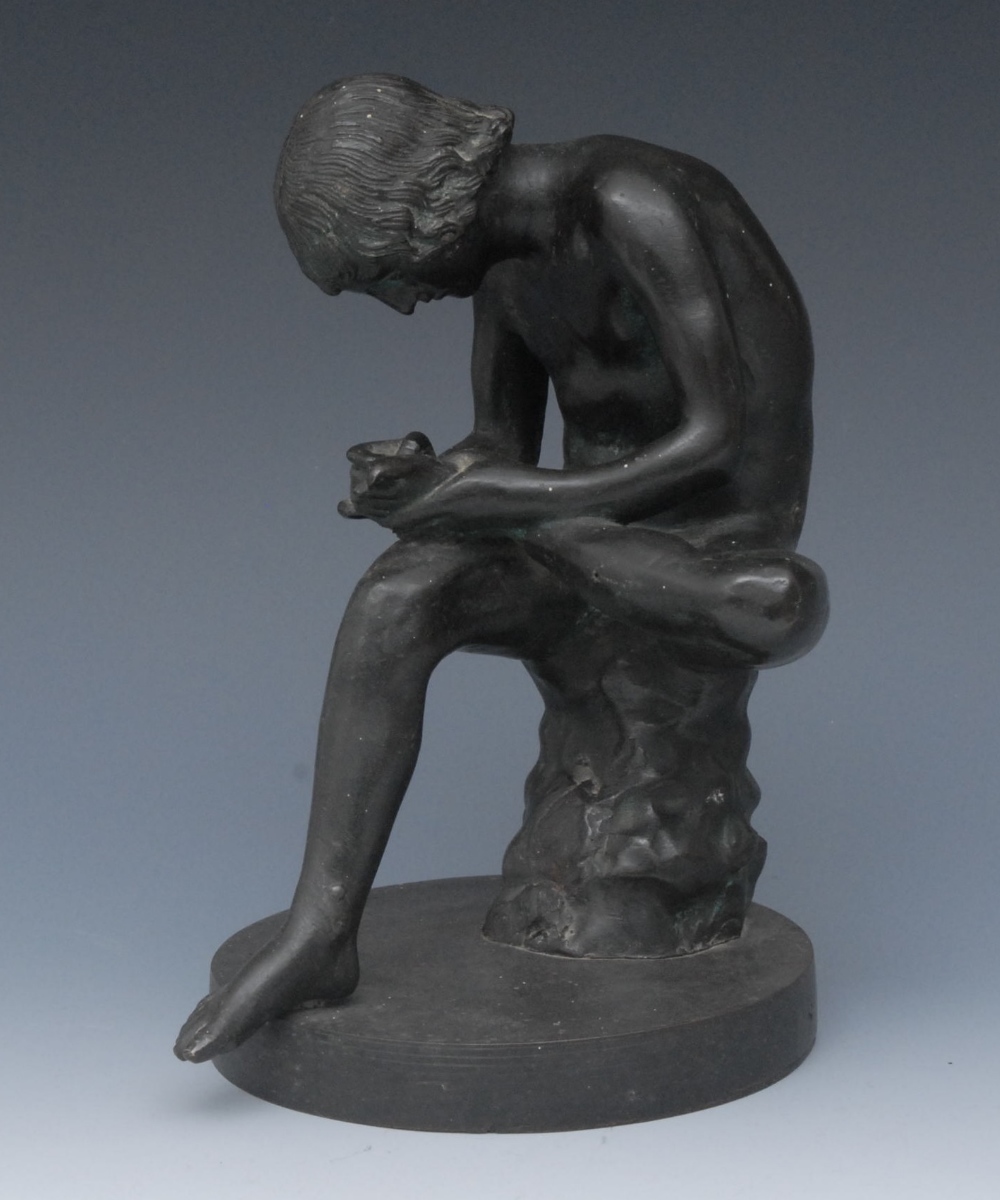 Italian School (19th Century), after the Antique, a dark patinated bronze, Spinario, seated,